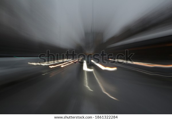 Cars drive through the streets on a gloomy autumn
day, in motion