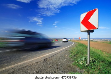 Cars Driving Down A Winding Road, Long Exposure, Blurred Motion