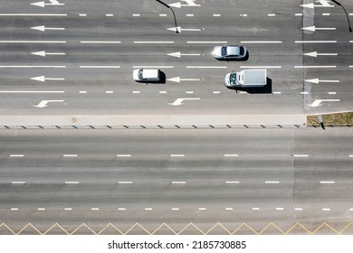 cars driving on asphalt road. slow traffic on highway. sunny summer day. aerial top view.
