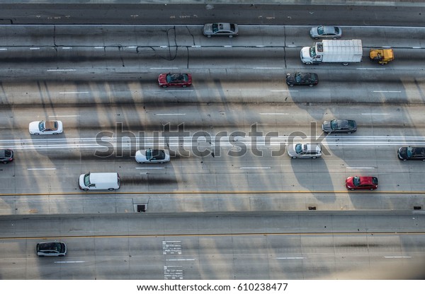 Cars driving on a\
highway, bird\'s eye view