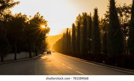 Cars driving on the road among the trees at sunset, Konya - Shutterstock ID 781589068