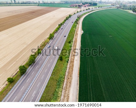 Cars driving on urban traffic road markup, aerial top view motorway  with blurry cars driving