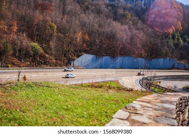 Cars Driving Through The Mountains On An Interstate Highway System