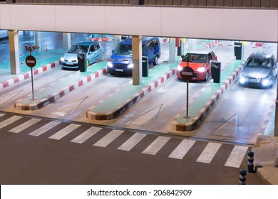 Cars Exiting A Parking Garage At The Airport. 