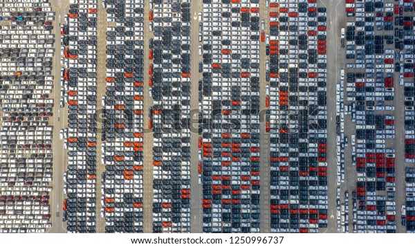 Cars export terminal in export and\
import business and logistics. Shipping cargo to harbor. Water\
transport International. Aerial view and top\
view.