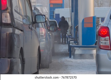 Cars At A Gas Station In The Winter