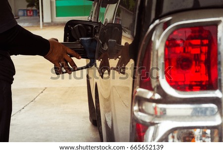 Cars get fuel at the fuel station to run. Compared to people who need food for a living.