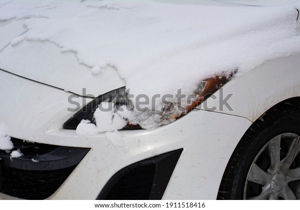 the car\'s\
headlights were covered with\
snow