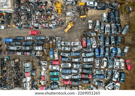 Cars in a junkyard from above