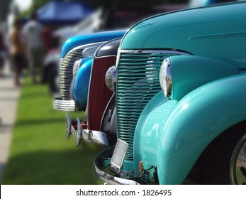 Cars Lined Up At A Vintage Car Show, Background Blurred