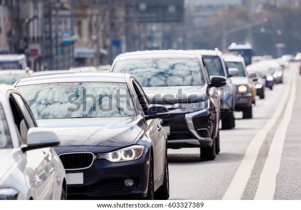 Cars in a long
queue on the busy city
street