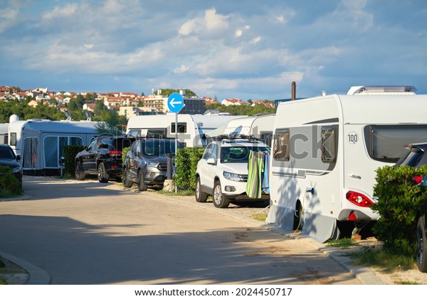  Cars and Mobile homes on a popular campsite on\
the island of Krk near the town of the same name Krk in Croatia    \
                         