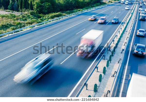 Cars in motion\
blur on highway,Beijing\
China