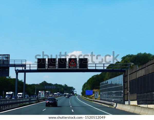 \
Cars in motion on the autobahn. Germany.\
Cars at speed. Beautiful nature.\
Track.
