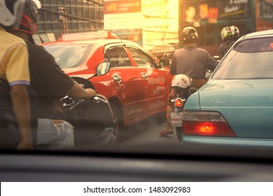 Cars And Motorcycles Wait At Traffic Jam In The Morning In Polution Concept