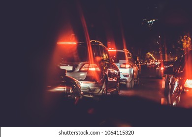 Cars in the night traffic jam . Looking behind the cars.Cars are red, yellow night light. Traffic jams in the city with row of cars on the road at night and bokeh lights in Baku with selective focus  - Powered by Shutterstock