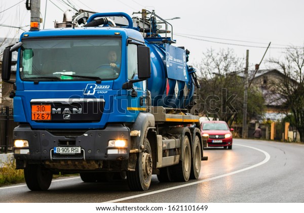 Cars on the asphalt\
road. utility car (from Rohrer Group company) in traffic. \
Targoviste, Romania, 2020.