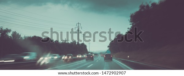 Cars on a highway at a rainy dusk (shallow DOF;
color toned image)