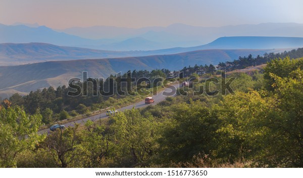Cars on a mountain winding\
road