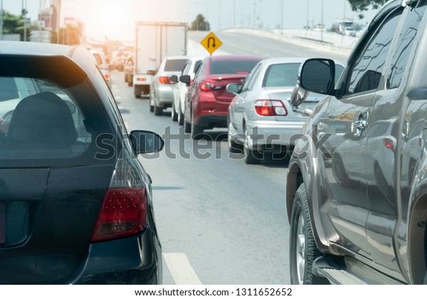 Cars on the road heading\
towards the goal of the trip, tourism by car, Break in traffic\
junction.