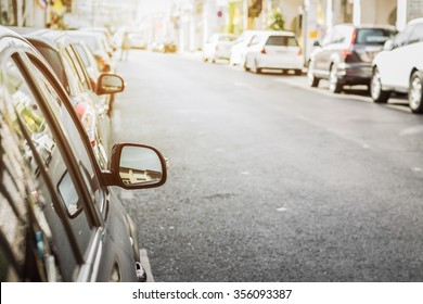 Cars On The Road From Sideview Mirror Under Sunlight In The Old Town, Phuket, Thailand