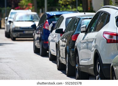 Cars Parked Along The Street.