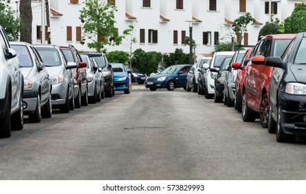 Cars Parked Along The Street.