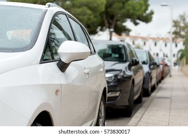 Cars Parked Along The Street.