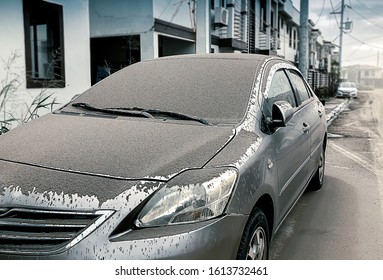 Cars Parked On The Side Of The Dormitory 
Affected From Volcanic Dust Fall, Dirty Surface Car In The Morning, 
Ashes Falling , Concept Dirty Car, Blur Background