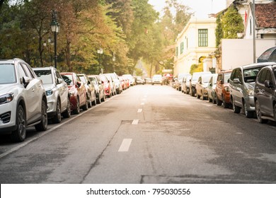 Cars Parked On The Urban Street Side