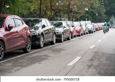 Cars Parked On The Urban Street Side