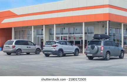 Cars Parked Outside A Cafe On A Summer Day