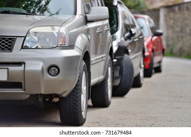 Cars Parked In A Row On A City Street