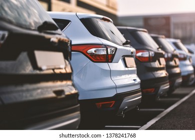 cars parked in row on outdoor parking - Shutterstock ID 1378241768