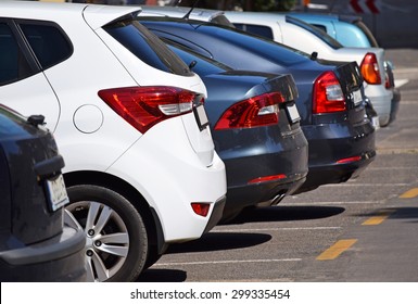 Cars in the parking lot - Shutterstock ID 299335454