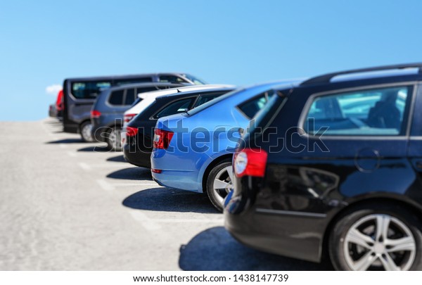 Cars in the\
parking lot. Parking passenger\
cars.