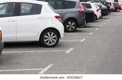 Cars in the parking lot in row - Shutterstock ID 423218617