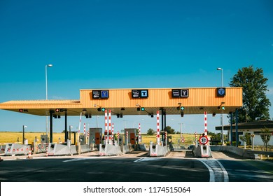 Cars Passing Through The Automatic Point Of Payment On A Toll Road. Point Of Toll Highway, Toll Station. Highway Toll Plaza Or Turnpike Or Charging Point, Entrance On Motorway.