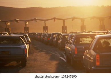 Cars queuing at a tollbooth