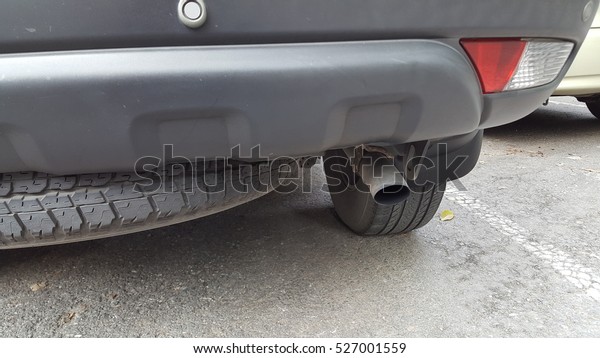 car\'s rear bumper with\
exhaust pipe