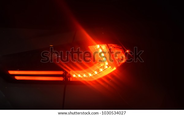 Cars red brake light illuminated lighting\
stock photograph