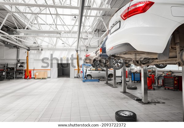 Cars for repair service station.
Repair and maintenance of the car engine in the
service.