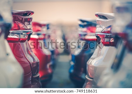 Cars For Sale. Automotive Industry. Cars Dealership Parking Lot. Rows of Brand New Vehicles Awaiting New Owners.