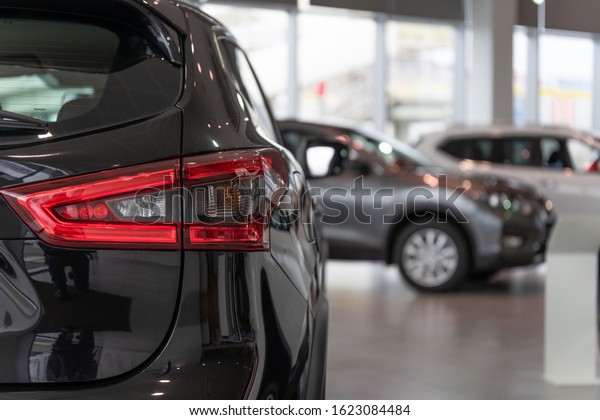Cars for sale. Automotive\
Industry. Cars dealership parking lot. Image of new vehicles in car\
showroom