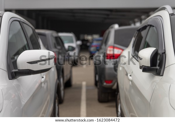 Cars\
for sale in a car dealership outdoor. Car\
showroom
