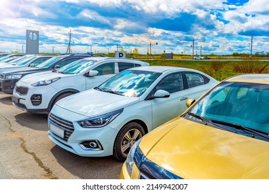 Cars For Sale Stock Lot Row, Taken In Backlit And Sun Glare. Car Dealer Inventory, Car Market.