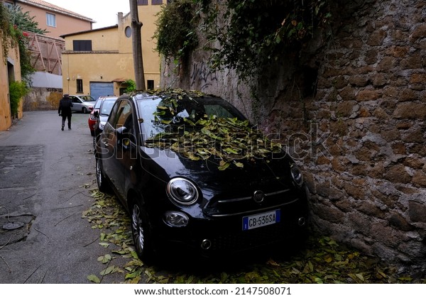 Cars are seen parked on the sight of street in
central  Rome on October 29,
2021