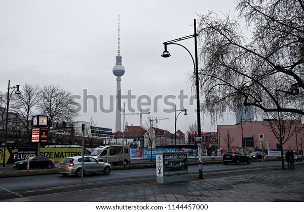 Cars seen\
in the strees in front of the television tower, Berliner\
Fernsehturm in Berlin, Germany January 21,\
2018