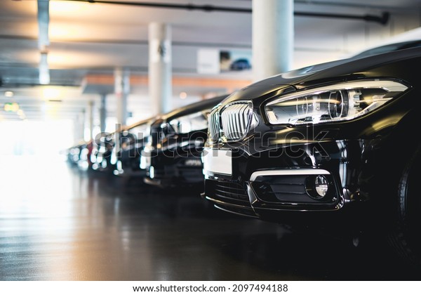 \
Cars in a showroom in the dealership, new\
cars, used cars, automotive\
industry