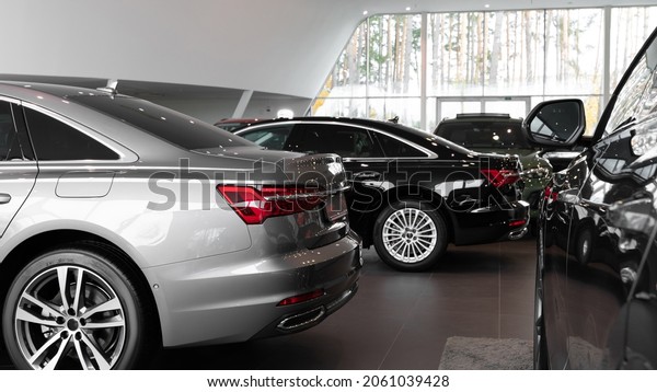 Cars in the showroom, luxury cars in the\
interior of a car\
dealership